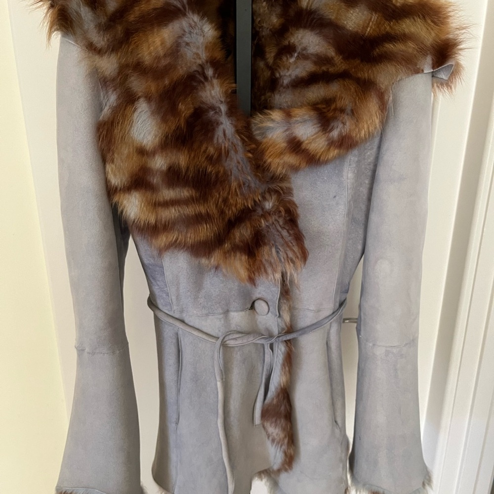 Light blue authentic fur/suede coat with side pockets, button closing, belt.